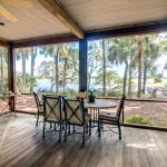 rustic-porch-with-forest-and-waterfront-view-PFFES9X.jpg